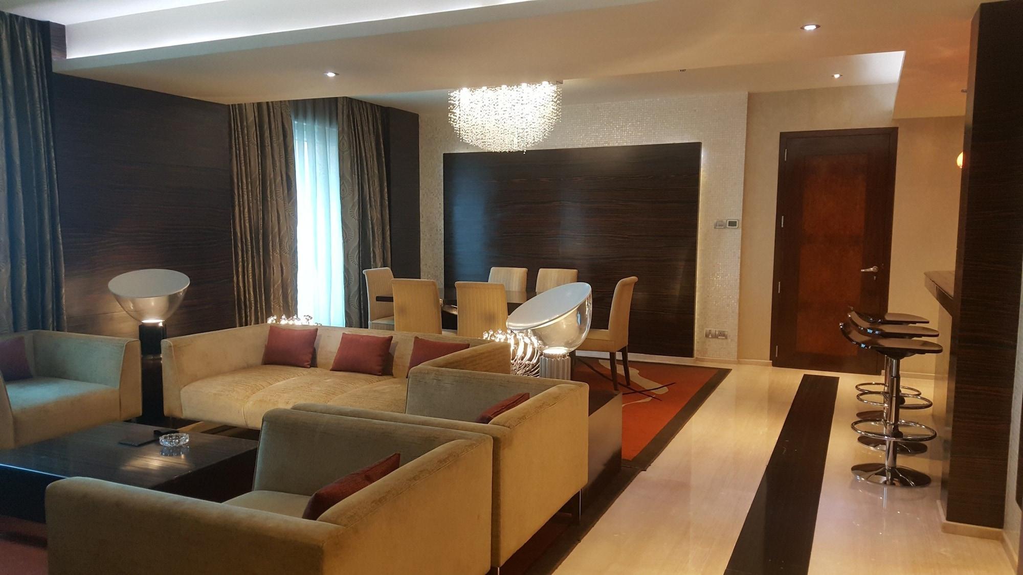 Vivanta Hyderabad, Begumpet Luaran gambar A living room in a suite at the Ritz-Carlton, DIFC